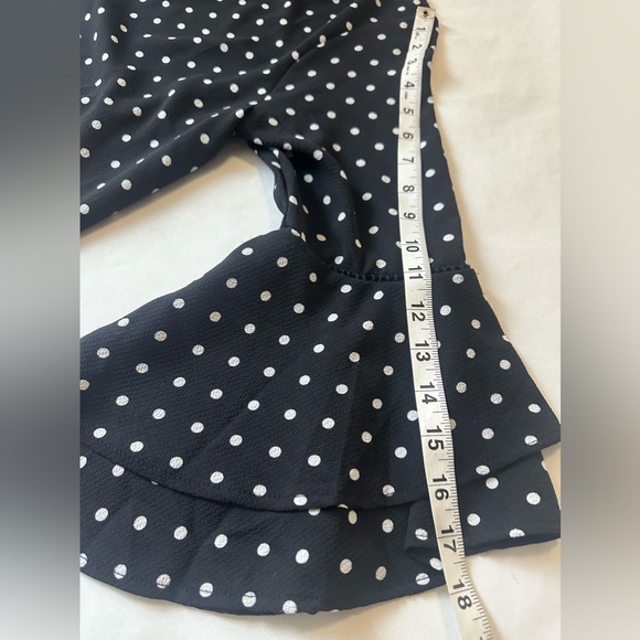 Brand: NAIF, black dress, with white dots, and flared sleeves - Picture 8 of 12